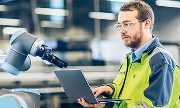 Service technician at work on a production system