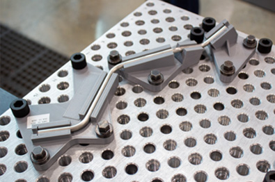 Inconel tube on comparison fixture for aerospace application.